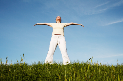 Woman in white with arms out